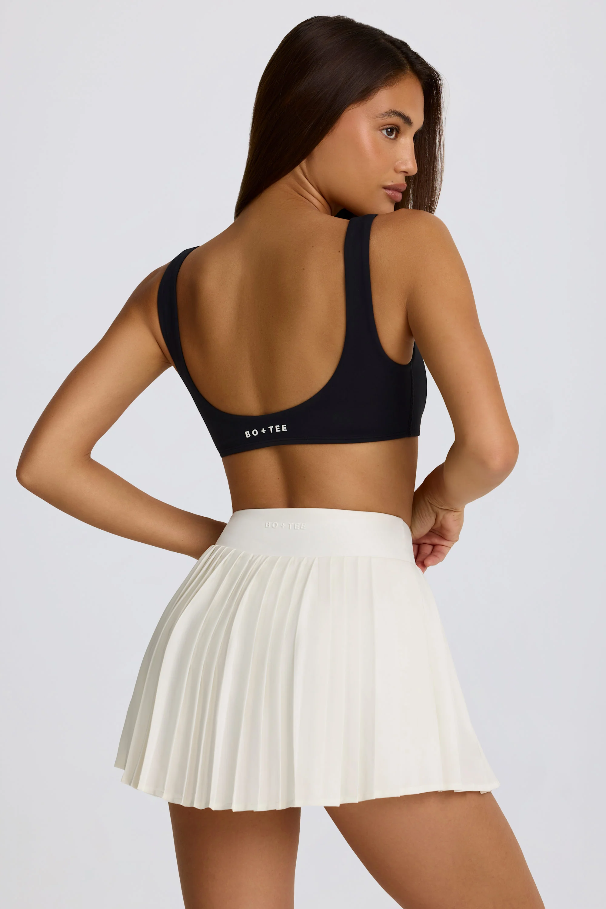 Soft Active Crossover Pleated Mini Skort in Milk - Image 2